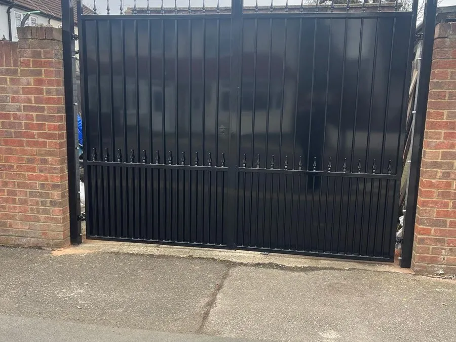 Commercial gates in Harlow installed between brick piers at a business entrance