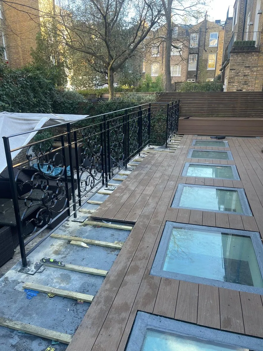 Metal railings installed along a decked roof terrace in Harlow