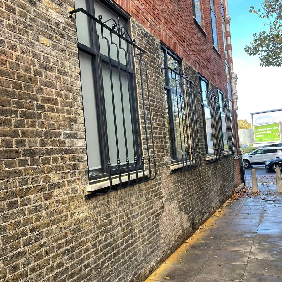 Security grilles in Harlow fitted to the windows of a brick commercial building