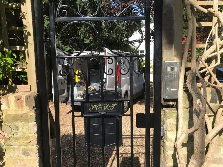 Decorative wrought iron gates in Harlow with scrollwork detailing