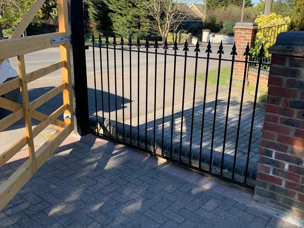 Driveway gate and railings on a corner plot