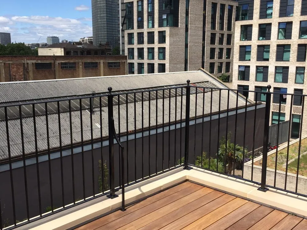 Balcony railings above a hardwood decked terrace