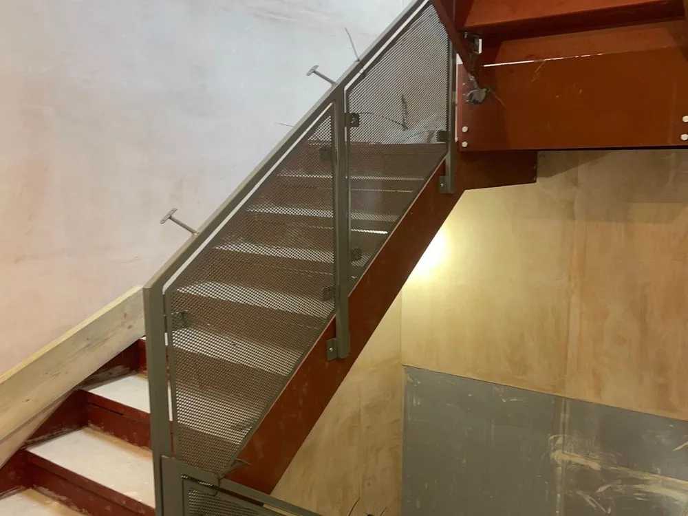 Staircase with glass balustrade infill panels